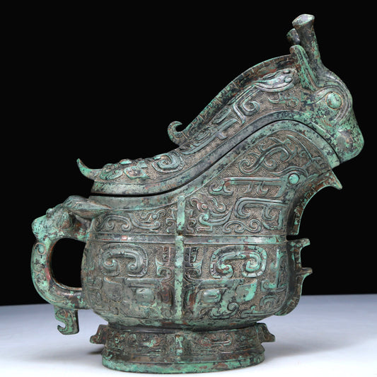 An Archaic Bronze 'Animal Mask' Ewer And Cover With Inscriptions