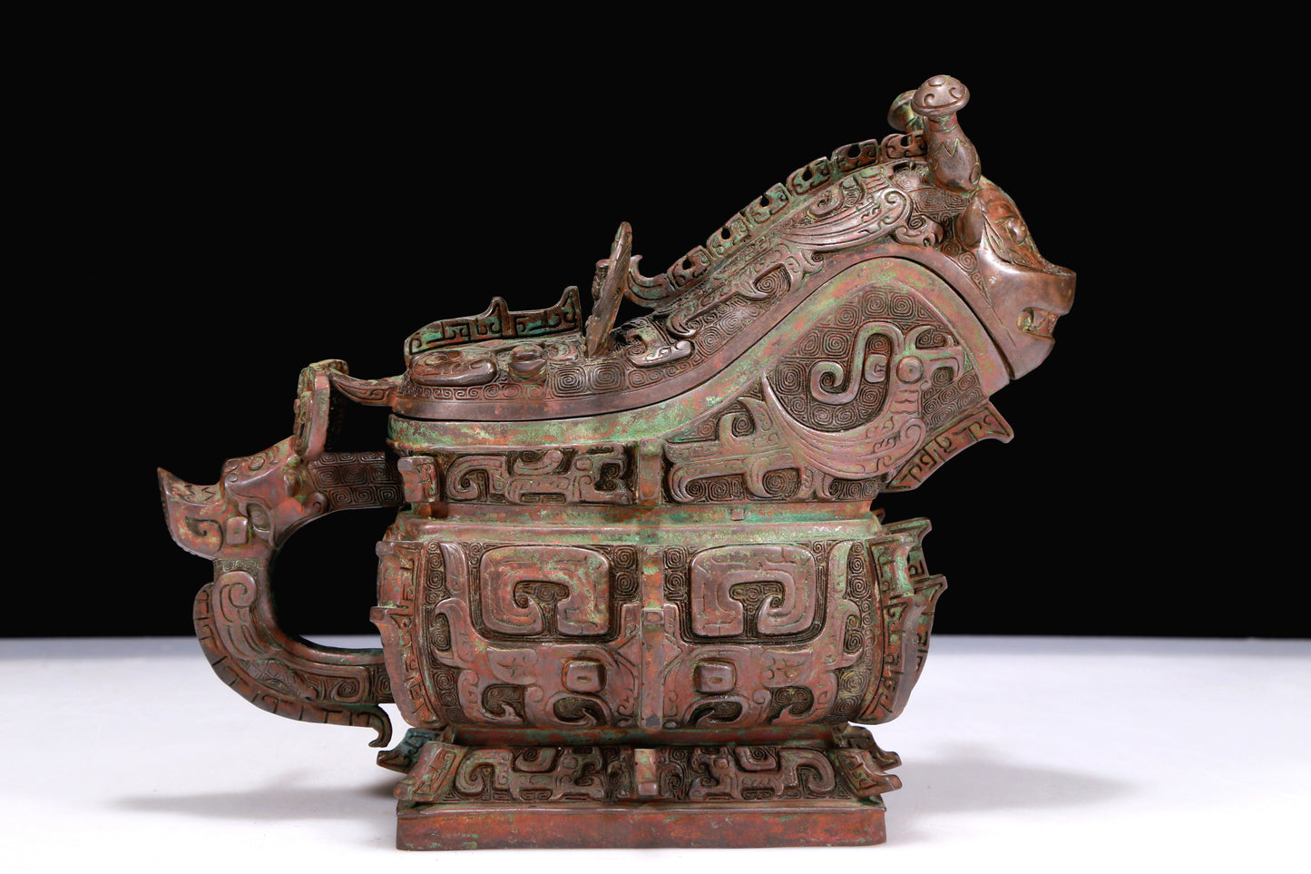 A Marvelous Bronze 'Animal Mask' Ewer And Cover With Inscriptions