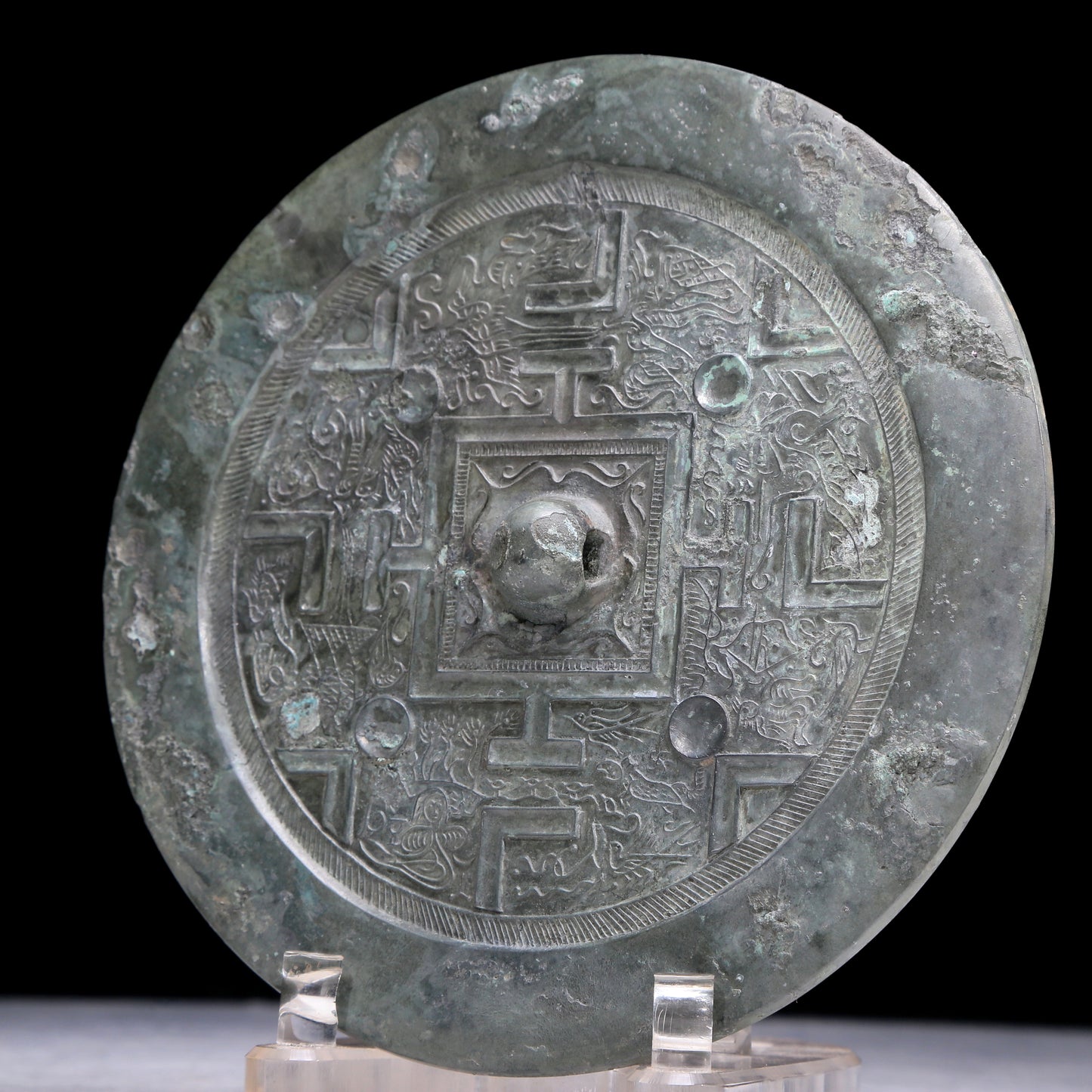 An Archaic Circular Bronze 'Auspicious Beast' Mirror