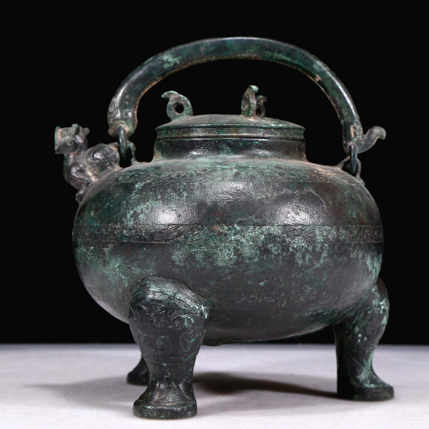 A Marvelous Bronze 'Auspicious Beast' Tripod Ewer