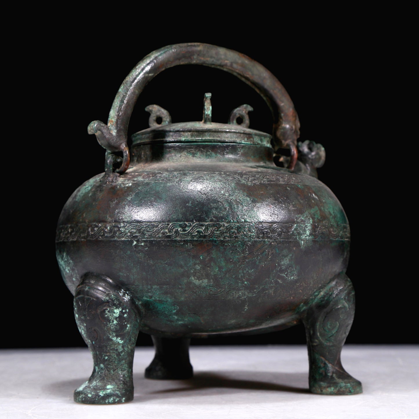 A Marvelous Bronze 'Auspicious Beast' Tripod Ewer