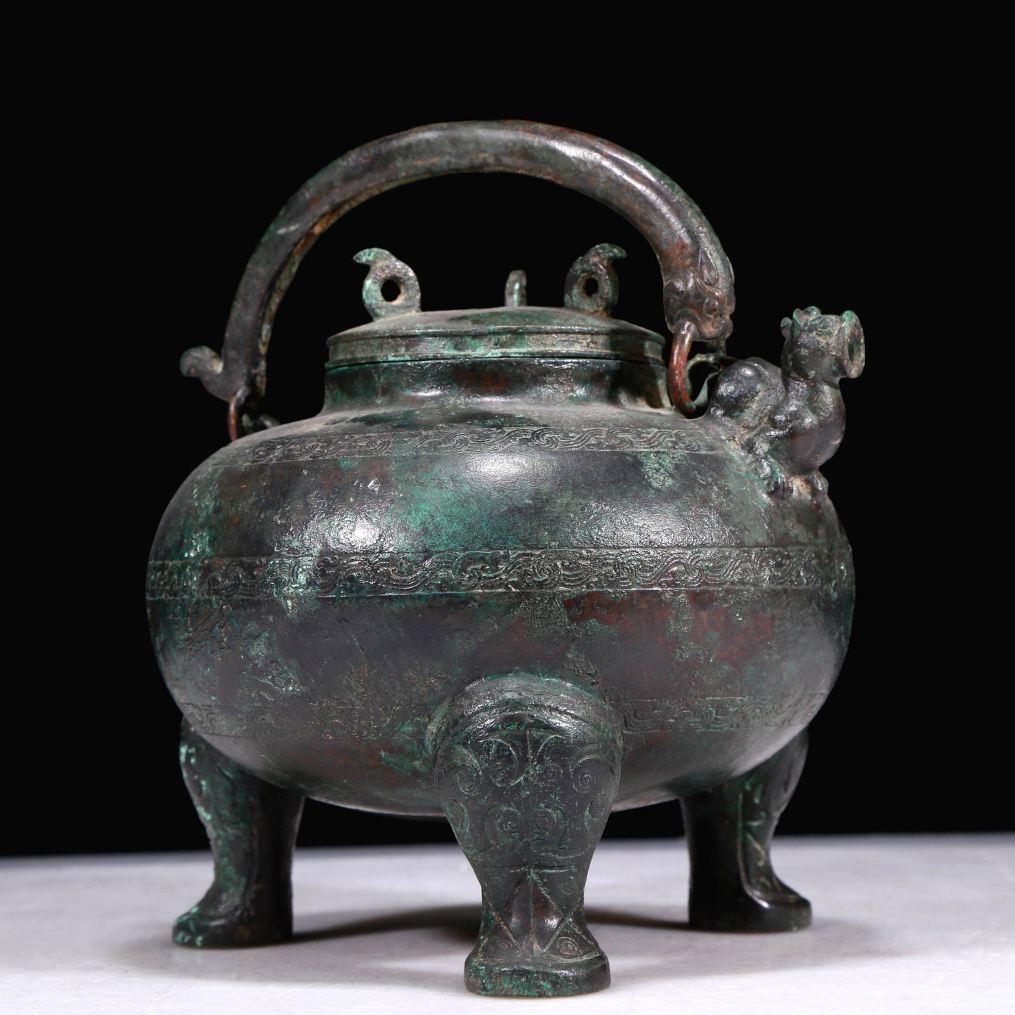 A Marvelous Bronze 'Auspicious Beast' Tripod Ewer