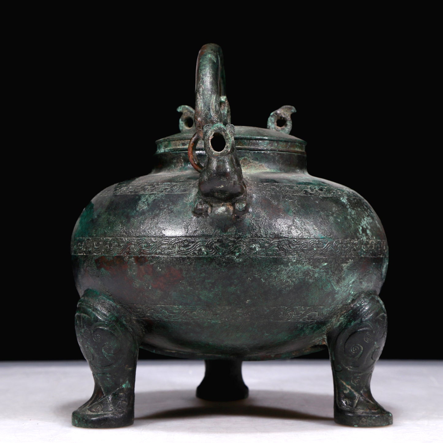 A Marvelous Bronze 'Auspicious Beast' Tripod Ewer