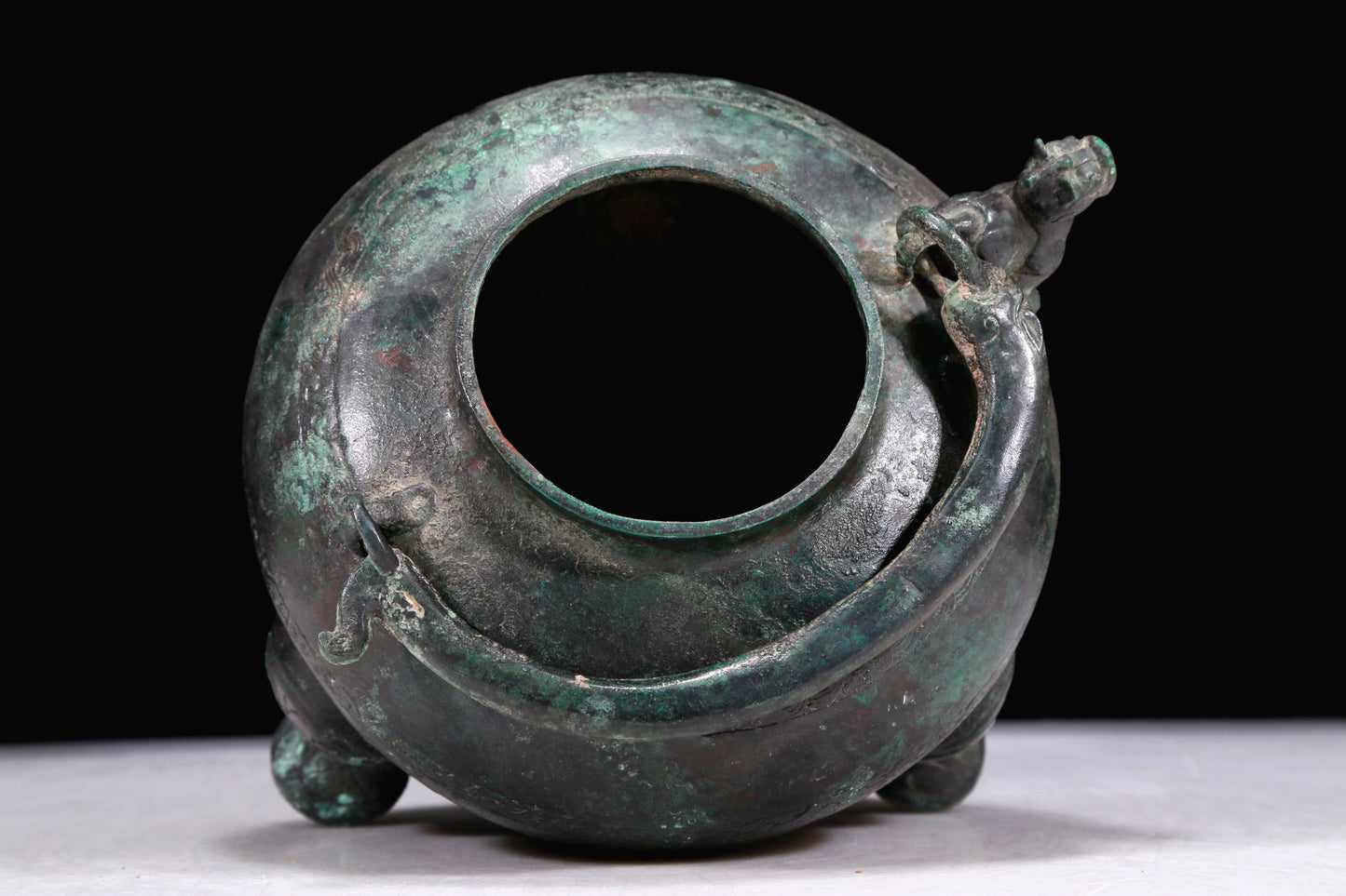 A Marvelous Bronze 'Auspicious Beast' Tripod Ewer