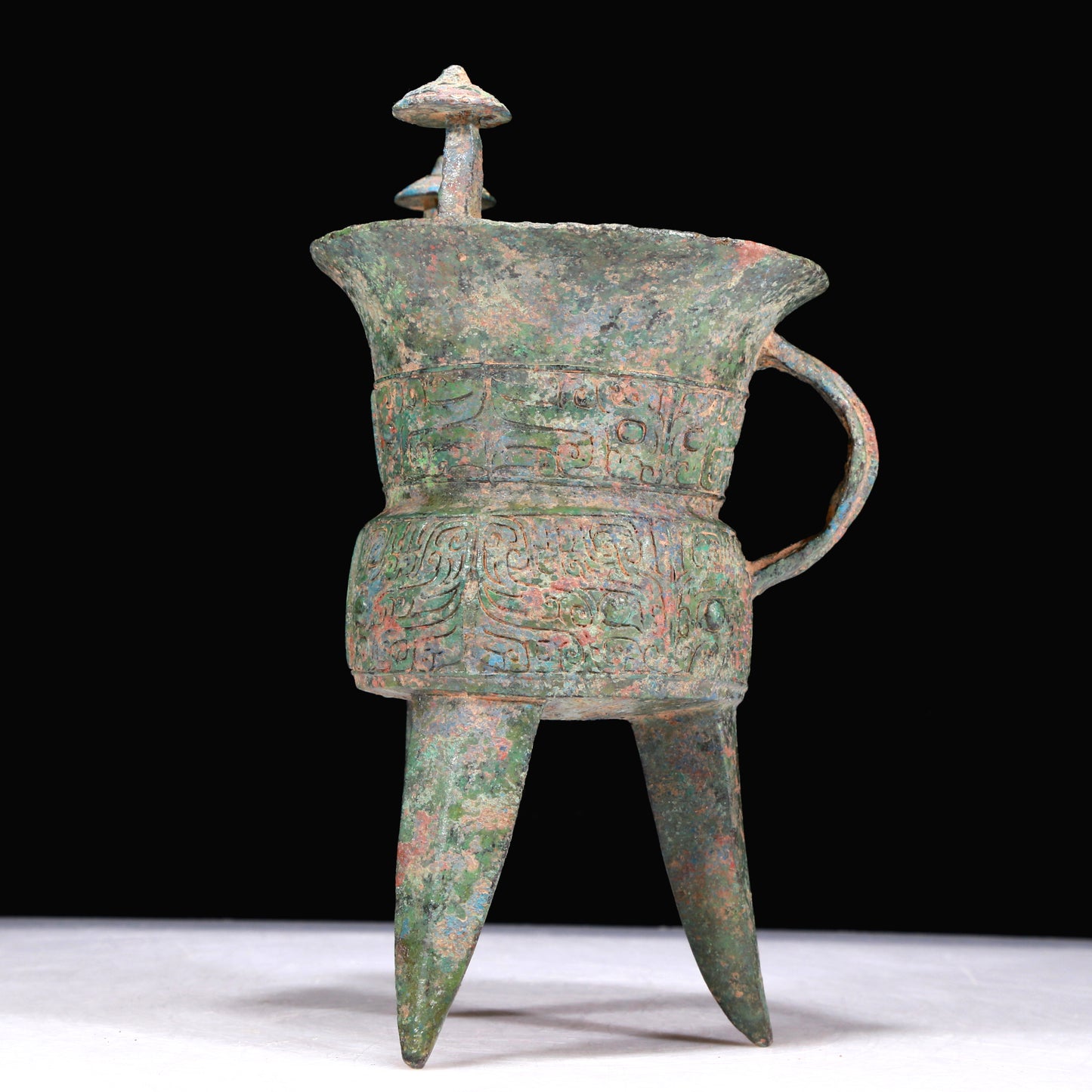 A Superb Bronze 'Animal Mask' Tripod Cup