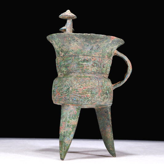 A Superb Bronze 'Animal Mask' Tripod Cup