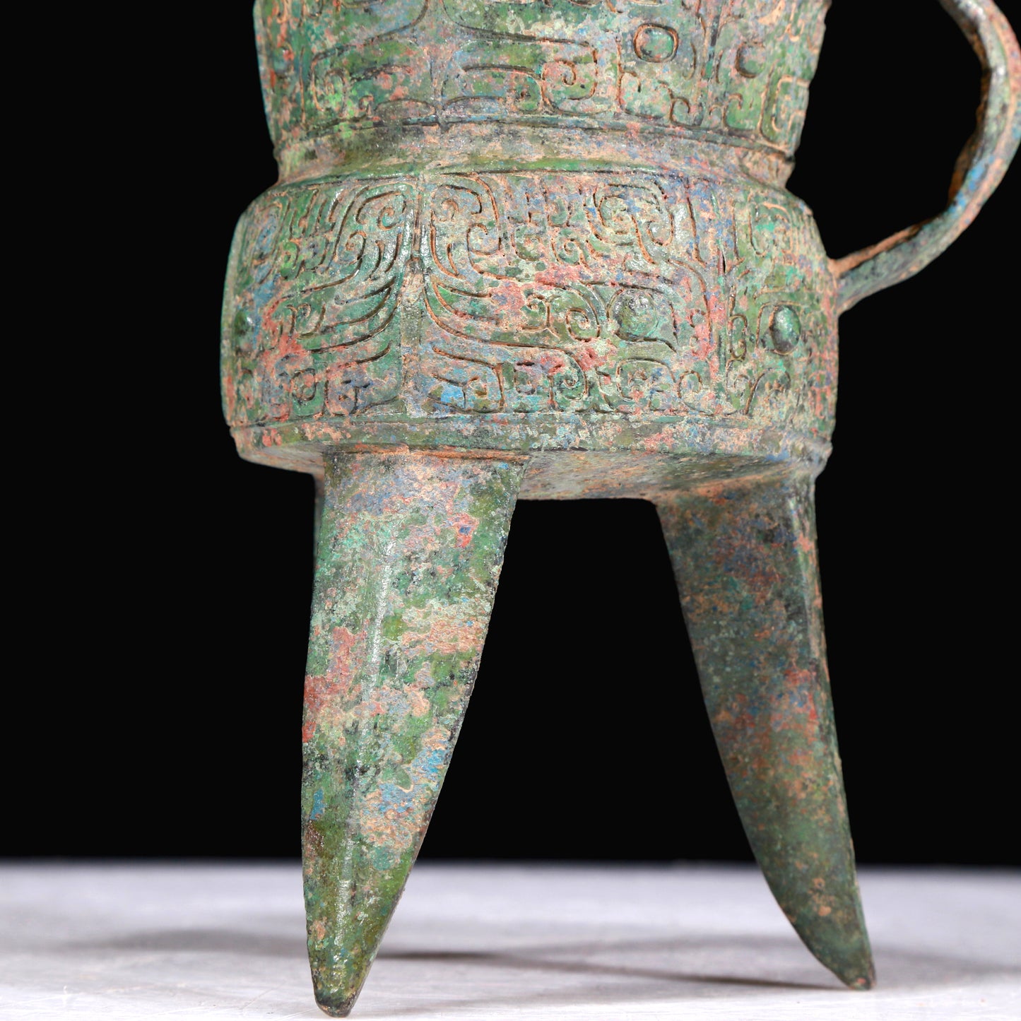A Superb Bronze 'Animal Mask' Tripod Cup