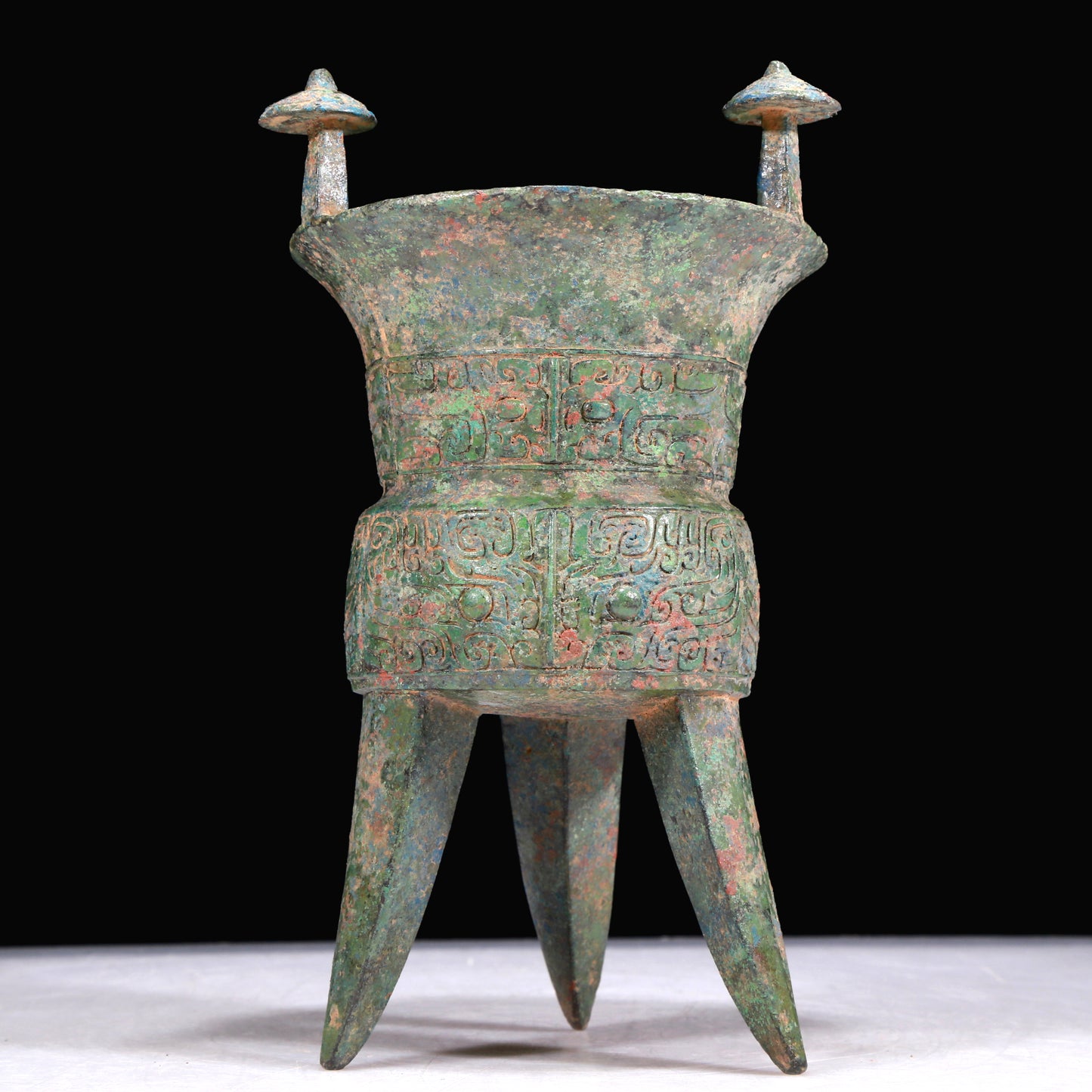 A Superb Bronze 'Animal Mask' Tripod Cup