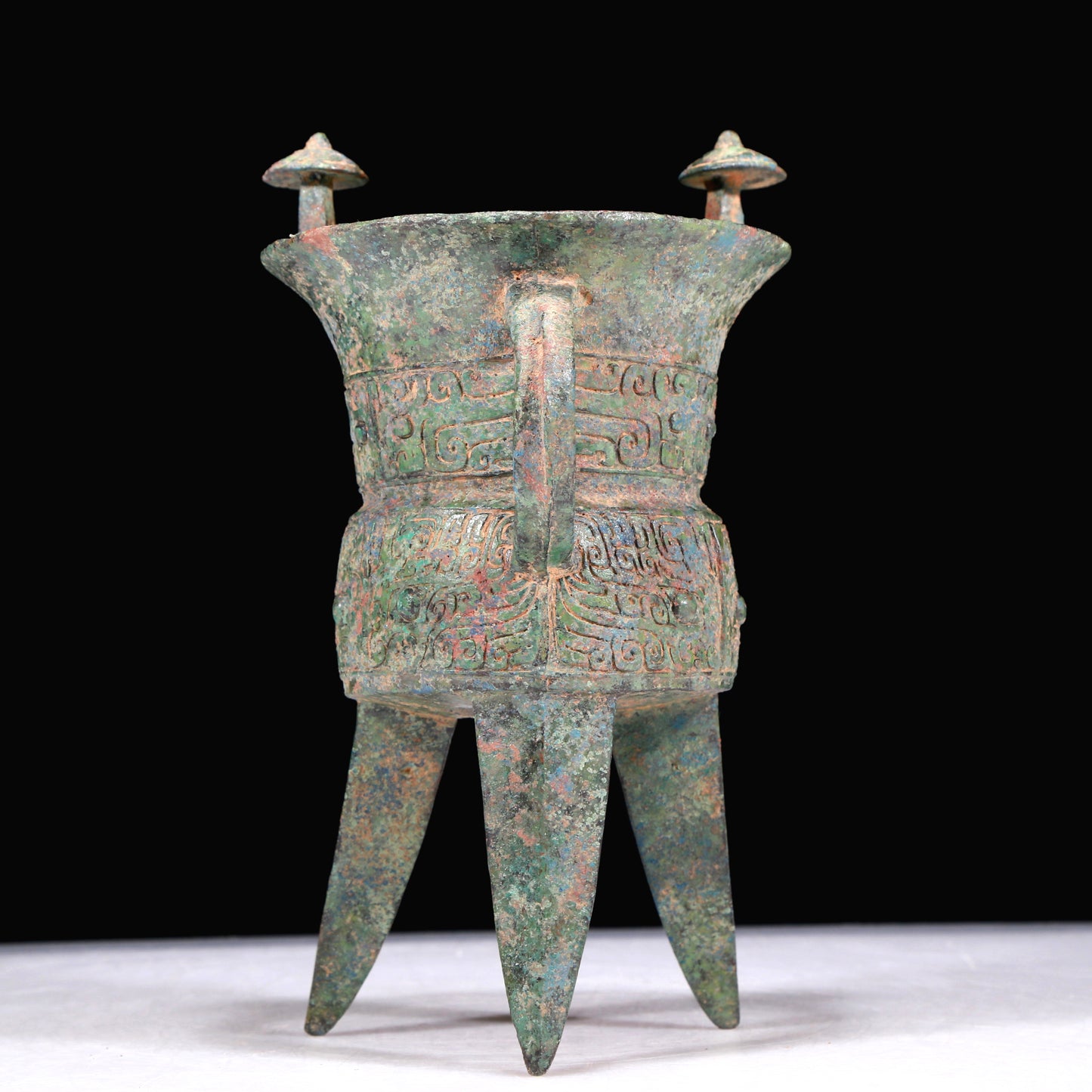A Superb Bronze 'Animal Mask' Tripod Cup