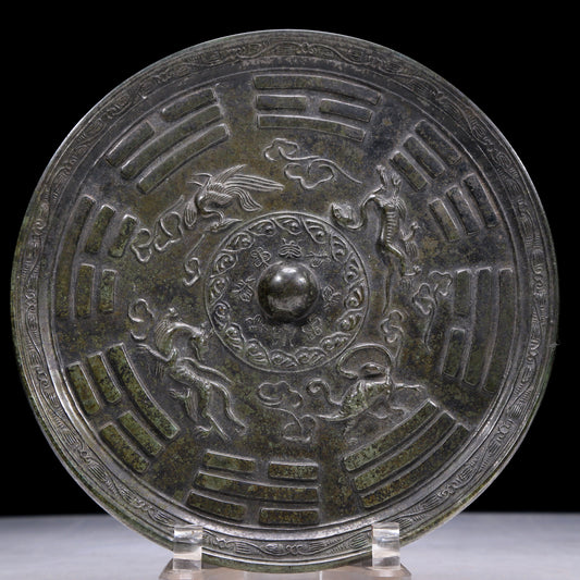 An Archaic Circular Bronze 'Auspicious Beast, Auspicious Cloud, The Eight Diagrams' Mirror