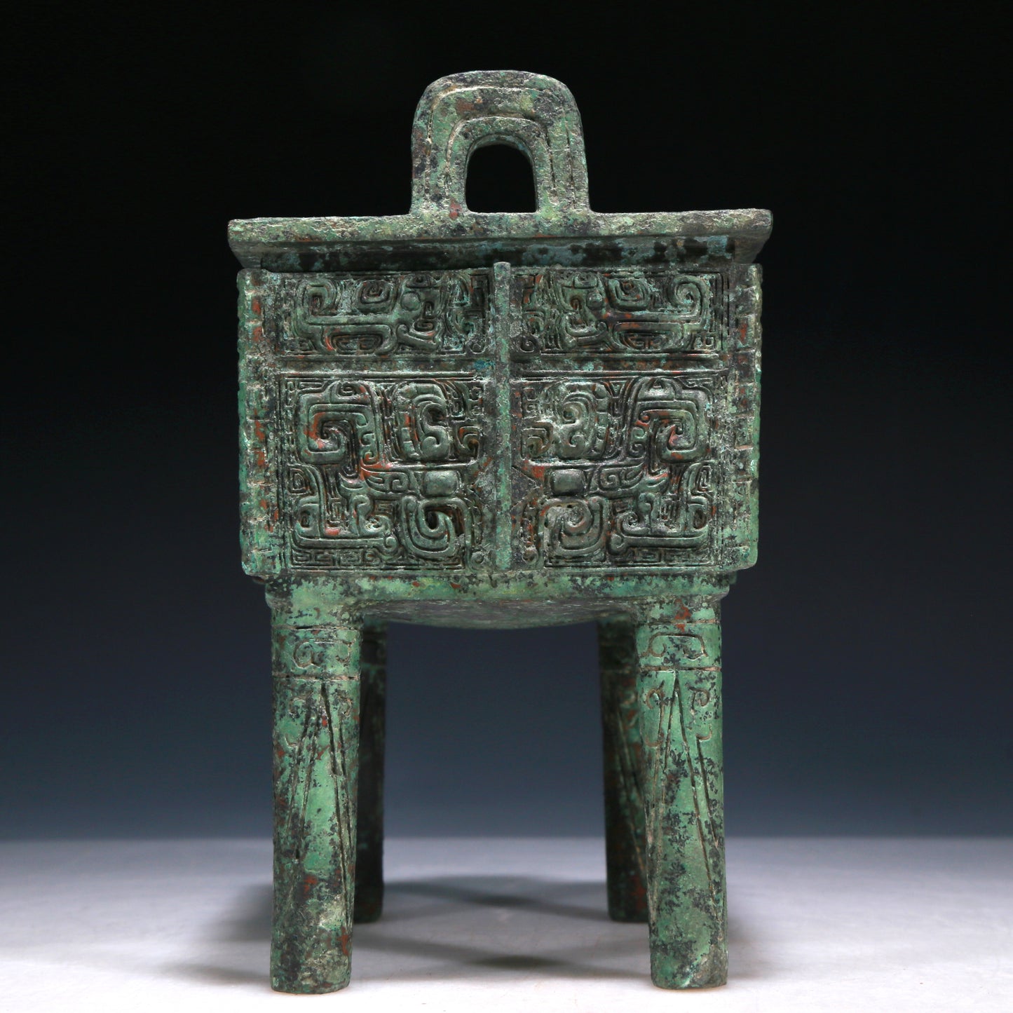 A Wonderful Bronze 'Animal Mask' Ritual Food Vessel, Ding, With Inscriptions