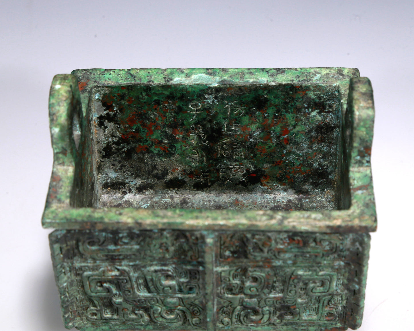 A Wonderful Bronze 'Animal Mask' Ritual Food Vessel, Ding, With Inscriptions