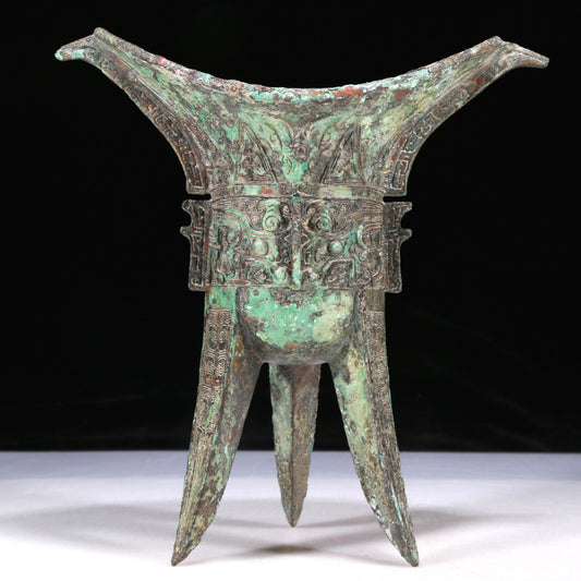 A Wonderful Bronze 'Animal Mask' Tripod Cup