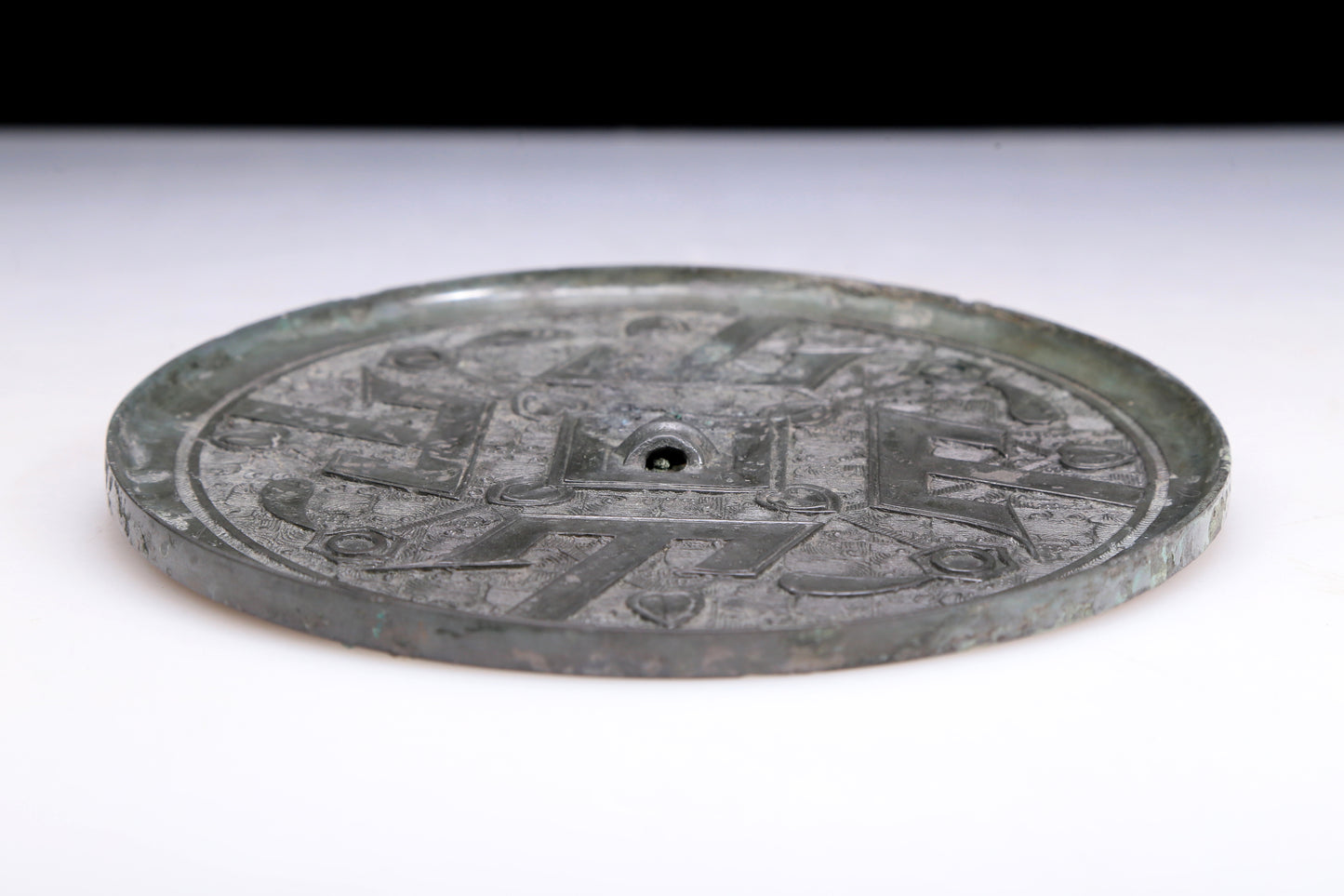 An Archaic Circular Bronze 'Ocean' Mirror