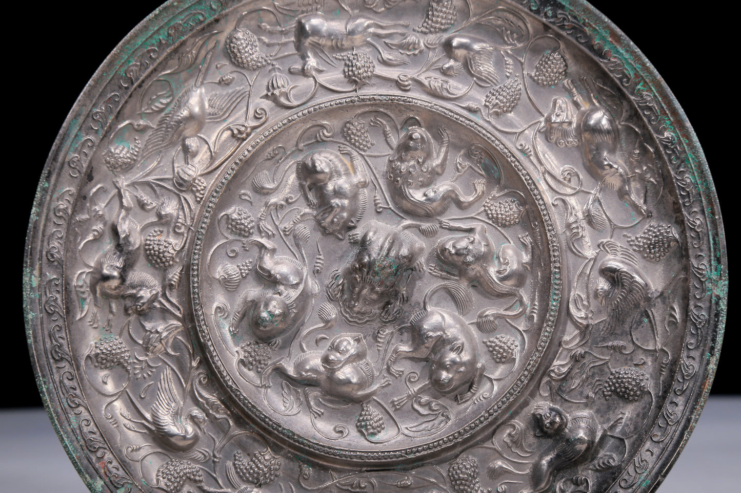 An Archaic Circular Silver-Bronze 'Flower& Auspicious Beast' Mirror