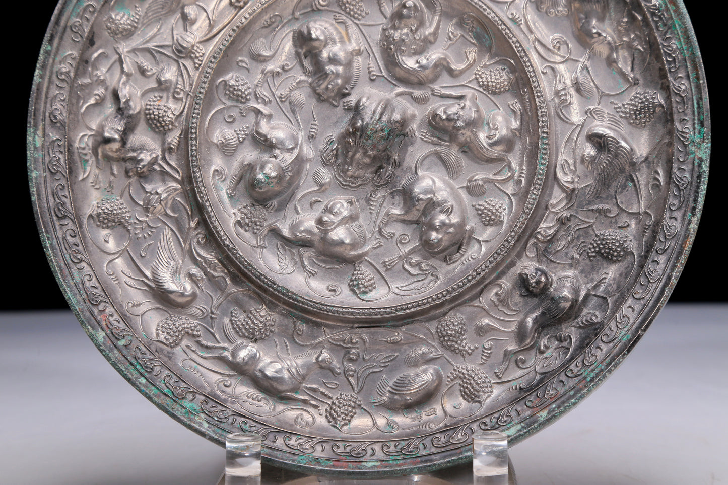 An Archaic Circular Silver-Bronze 'Flower& Auspicious Beast' Mirror