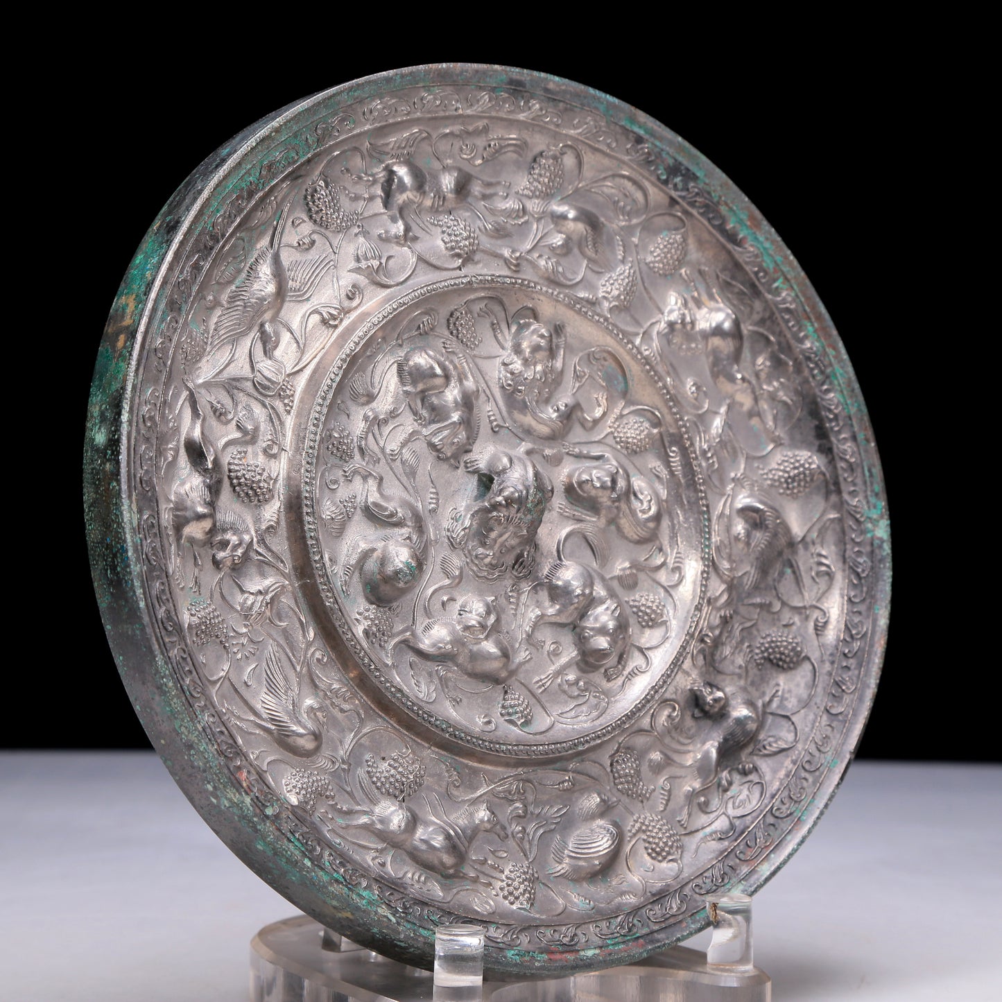 An Archaic Circular Silver-Bronze 'Flower& Auspicious Beast' Mirror