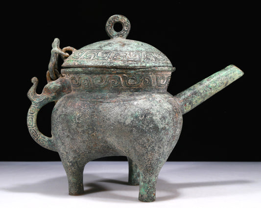 A Wonderful Bronze 'Auspicious Beast' Tripod Ewer