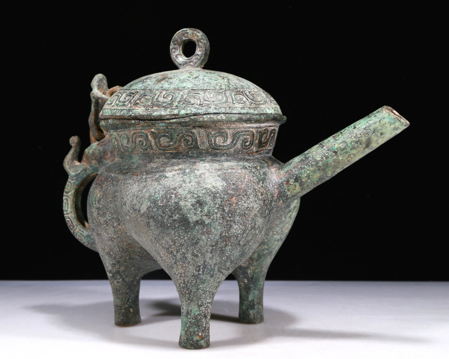 A Wonderful Bronze 'Auspicious Beast' Tripod Ewer
