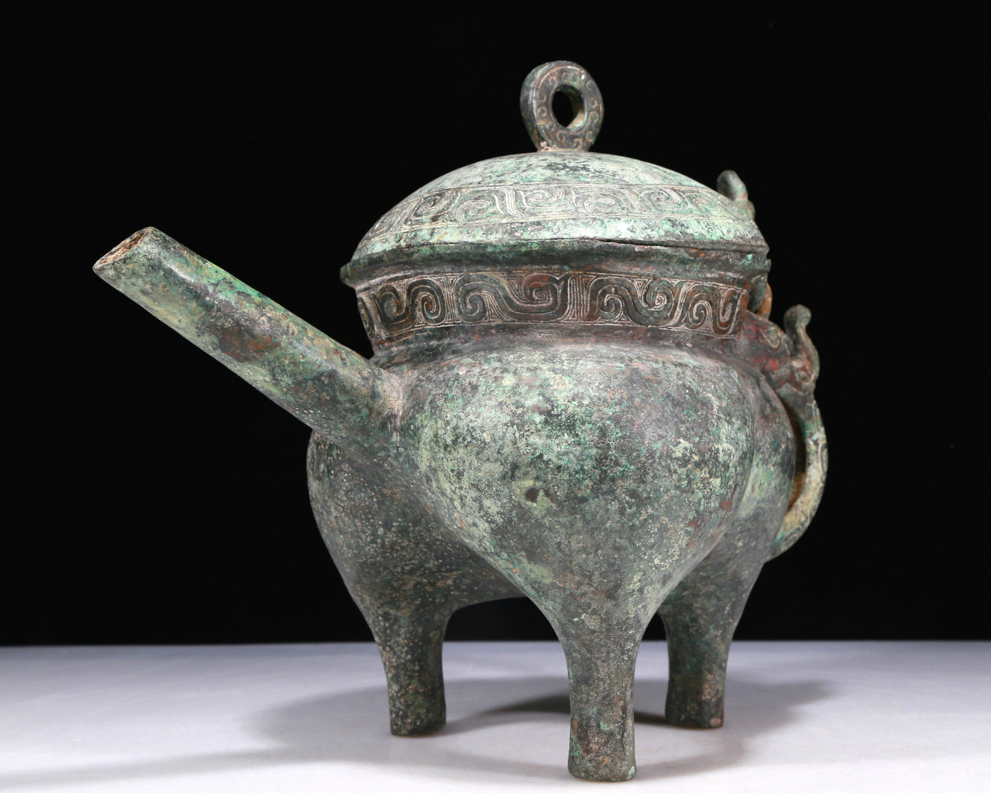 A Wonderful Bronze 'Auspicious Beast' Tripod Ewer