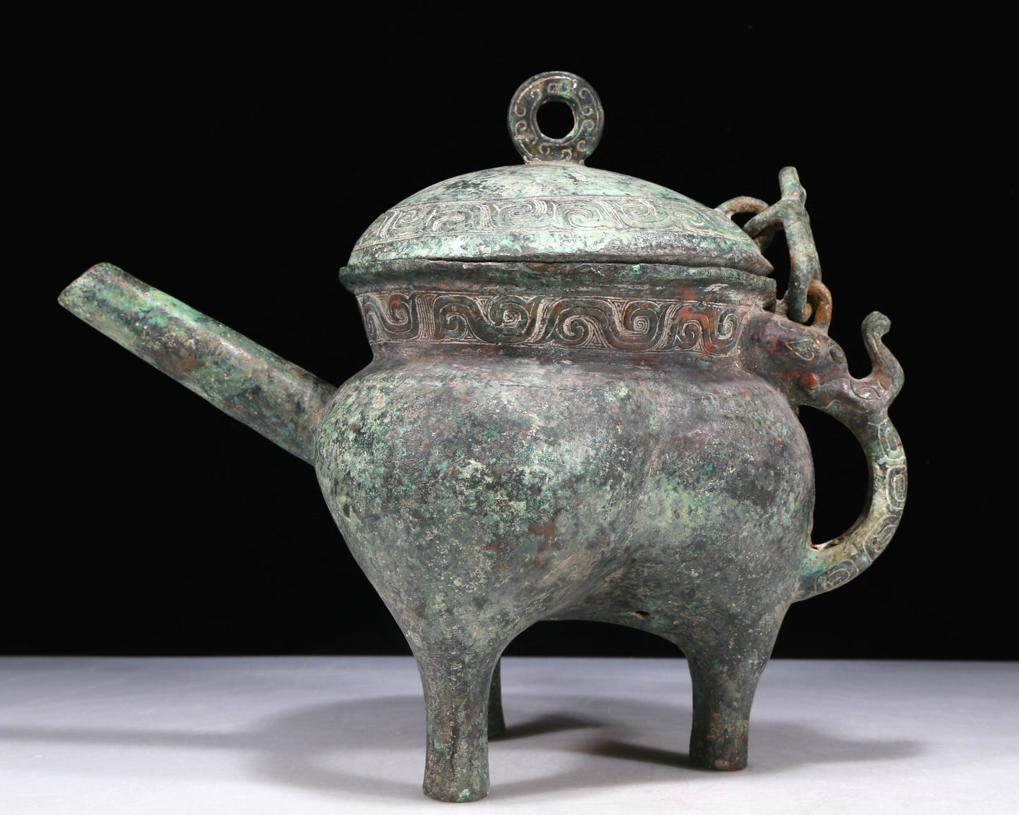 A Wonderful Bronze 'Auspicious Beast' Tripod Ewer