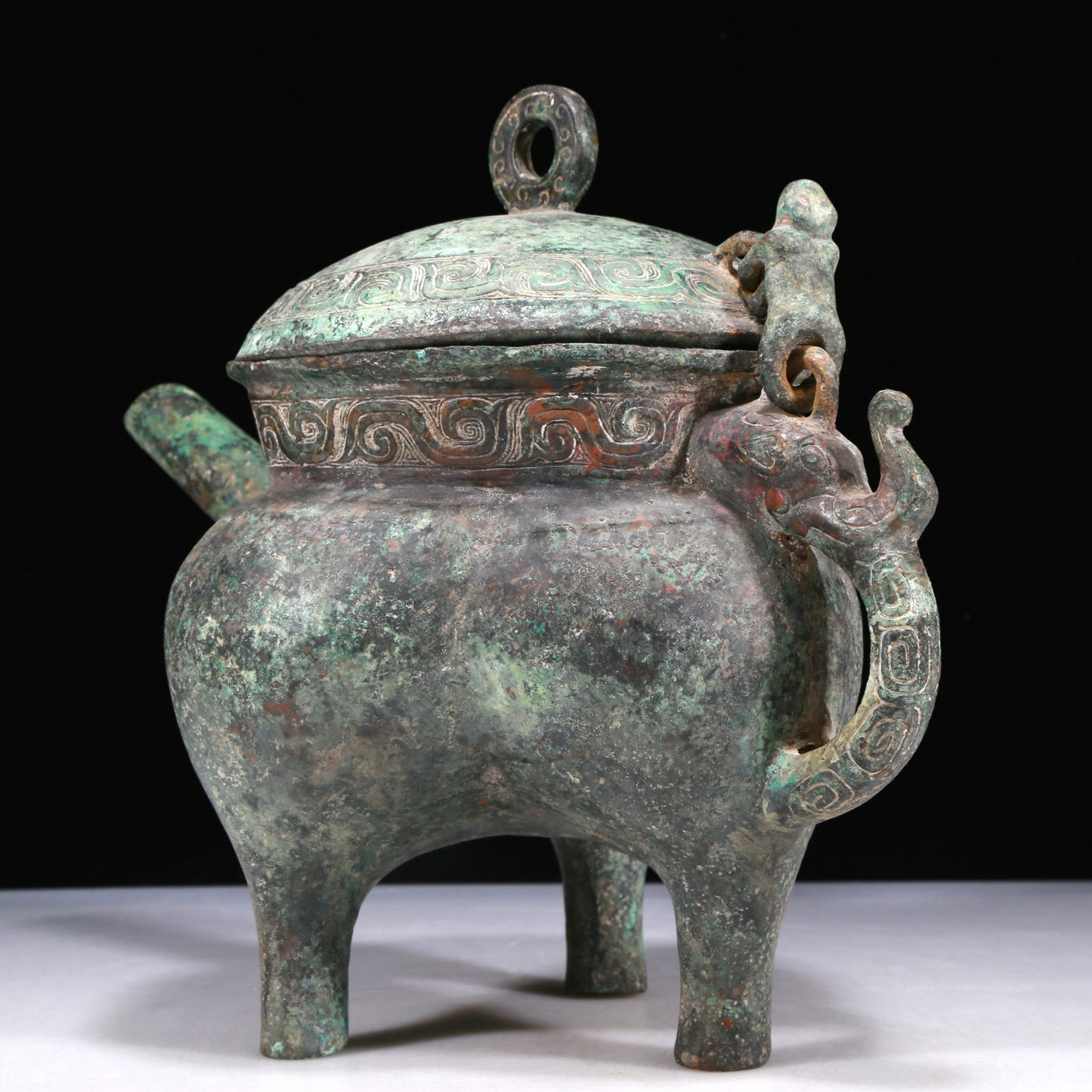 A Wonderful Bronze 'Auspicious Beast' Tripod Ewer