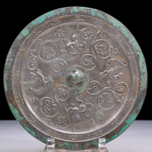 An Archaic Circular Bronze 'Flower& Auspicious Beast' Mirror