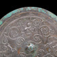 An Archaic Circular Bronze 'Flower& Auspicious Beast' Mirror