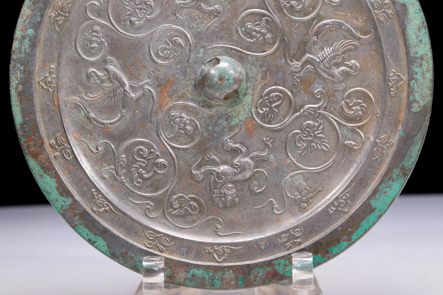 An Archaic Circular Bronze 'Flower& Auspicious Beast' Mirror