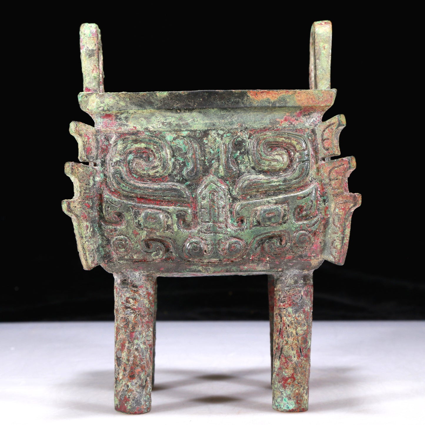 An Excellent Bronze 'Animal Mask' Ritual Food Vessel, Ding