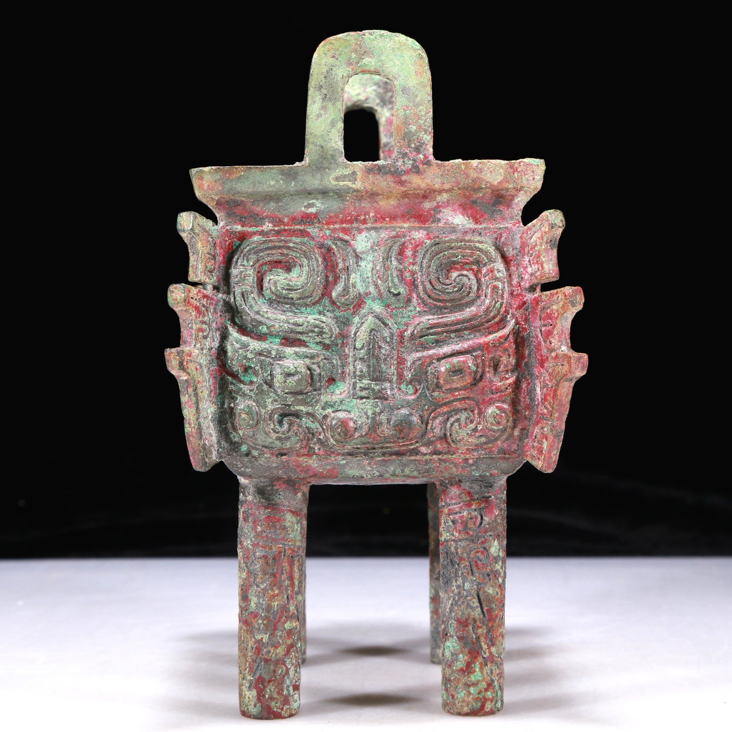 An Excellent Bronze 'Animal Mask' Ritual Food Vessel, Ding