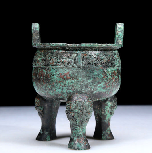 An Archaic Bronze 'Auspicious Beast' Tripod Censer