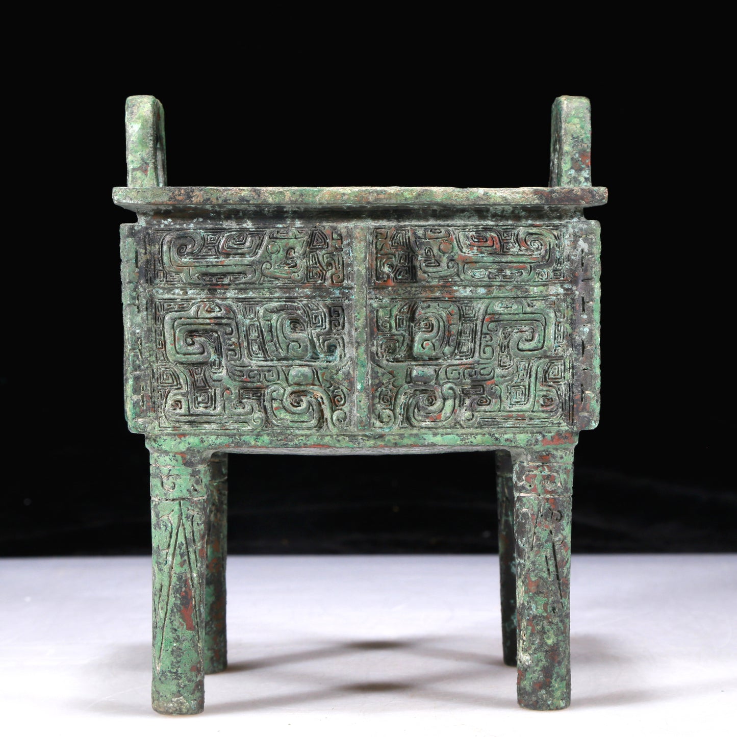 An Excellent Bronze 'Animal Mask' Ritual Food Vessel, Ding, With Inscriptions