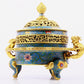 A cloisonné incense burner with two ears and three legs with lotus pattern