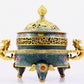 A cloisonné incense burner with two ears and three legs with lotus pattern