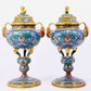 A pair of cloisonne lotus pattern bat ear incense burners