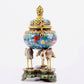 A cloisonné flower and bird pattern two-eared three-legged incense burner with lid