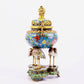 A cloisonné flower and bird pattern two-eared three-legged incense burner with lid