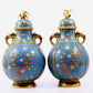 A pair of cloisonne flower and bird pattern amphora