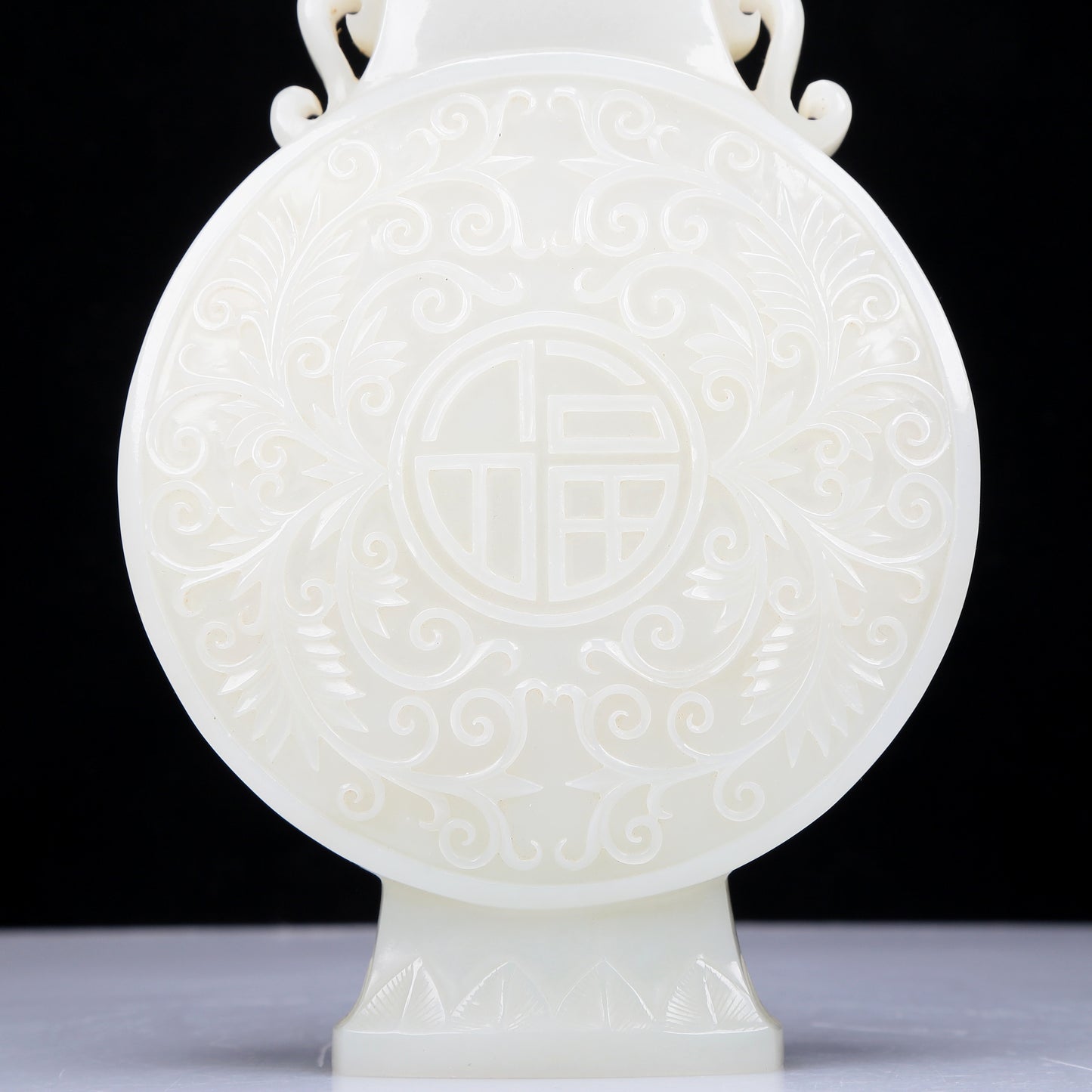 A Precious White Jade 'Scrolling Lotus' Vase And Cover