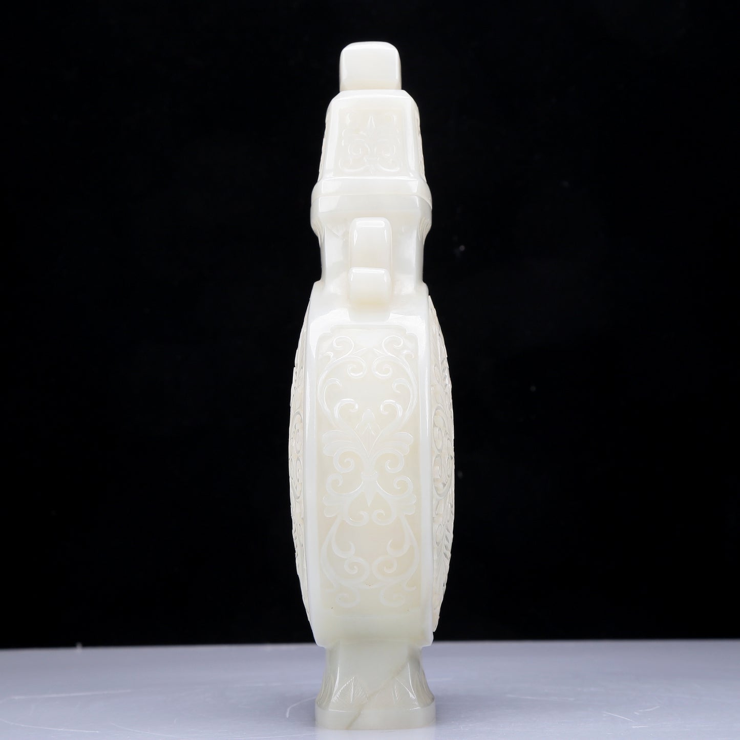 A Precious White Jade 'Scrolling Lotus' Vase And Cover