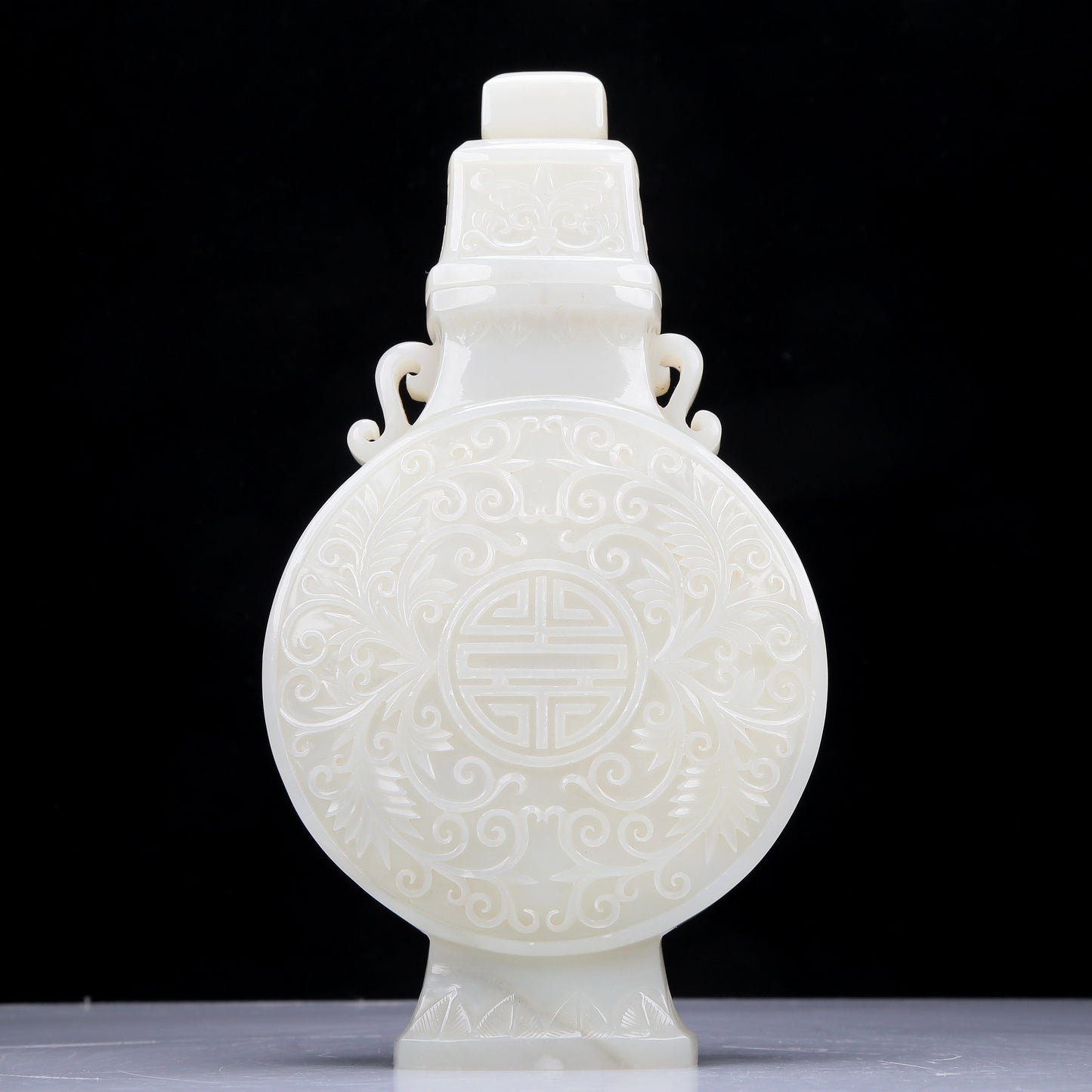 A Precious White Jade 'Scrolling Lotus' Vase And Cover