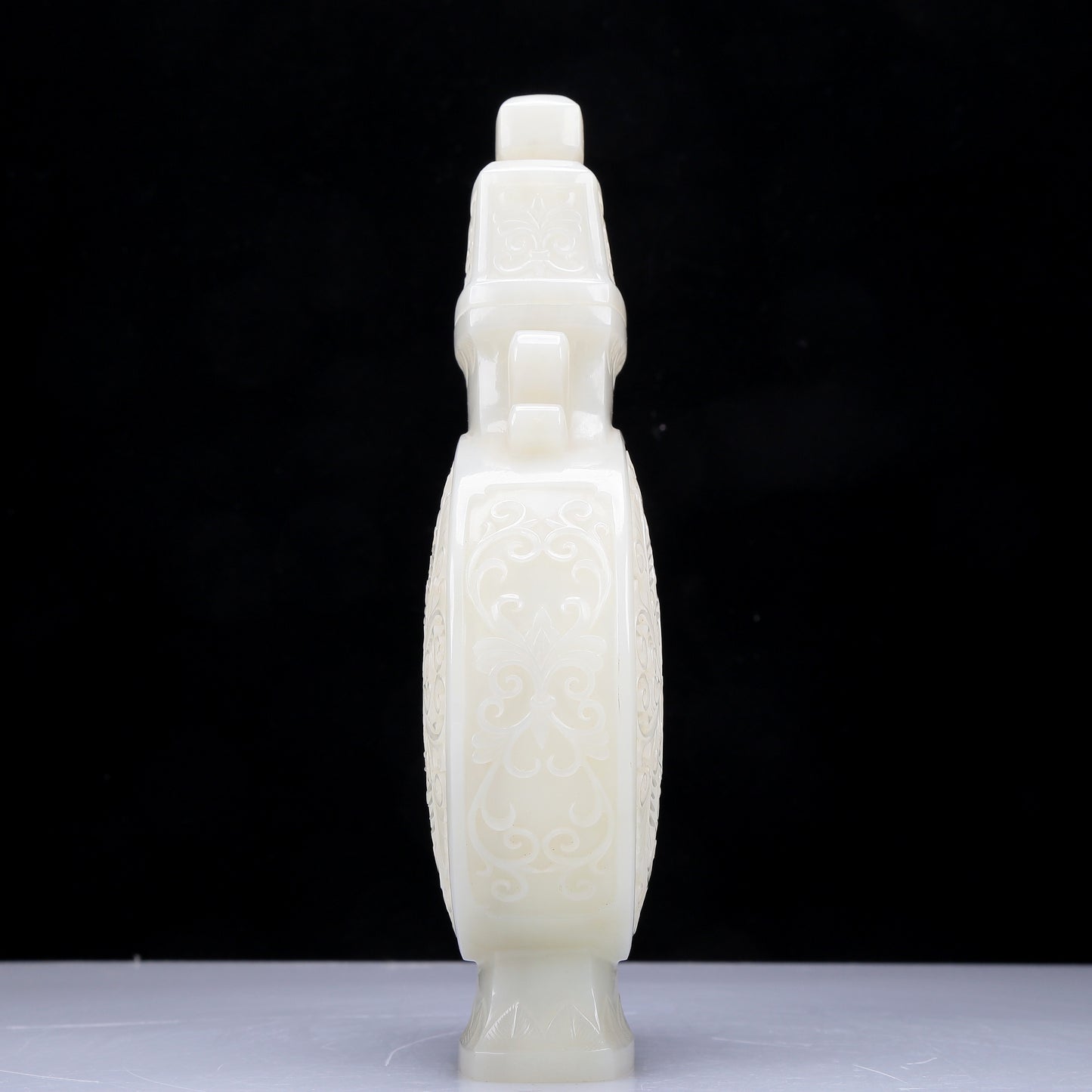 A Precious White Jade 'Scrolling Lotus' Vase And Cover