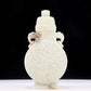 An exquisite white jade elephant ear vase with flower and bird patterns and lid