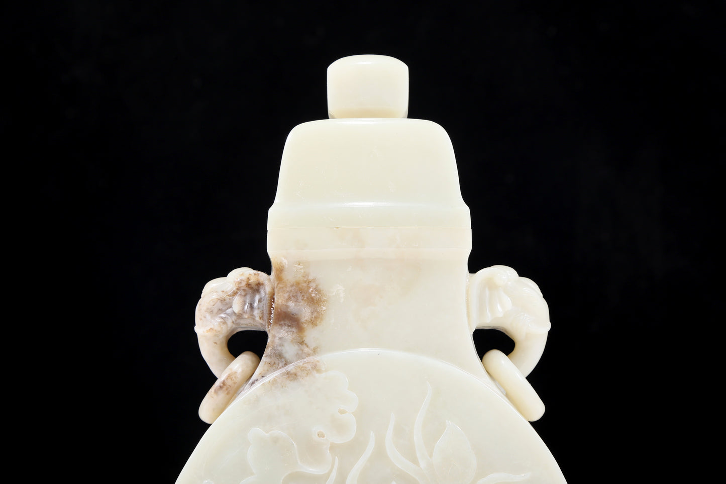 An exquisite white jade elephant ear vase with flower and bird patterns and lid