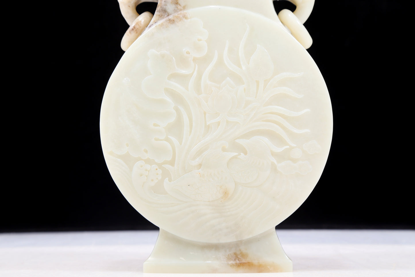 An exquisite white jade elephant ear vase with flower and bird patterns and lid