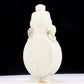 An exquisite white jade elephant ear vase with flower and bird patterns and lid