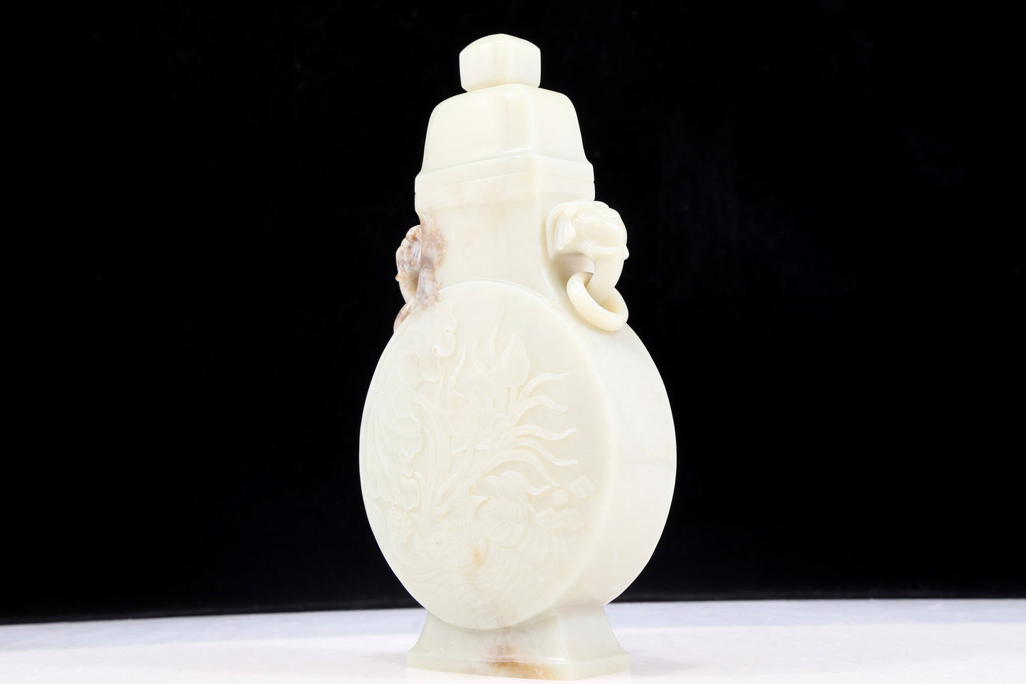 An exquisite white jade elephant ear vase with flower and bird patterns and lid