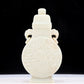 An exquisite white jade elephant ear vase with flower and bird patterns and lid