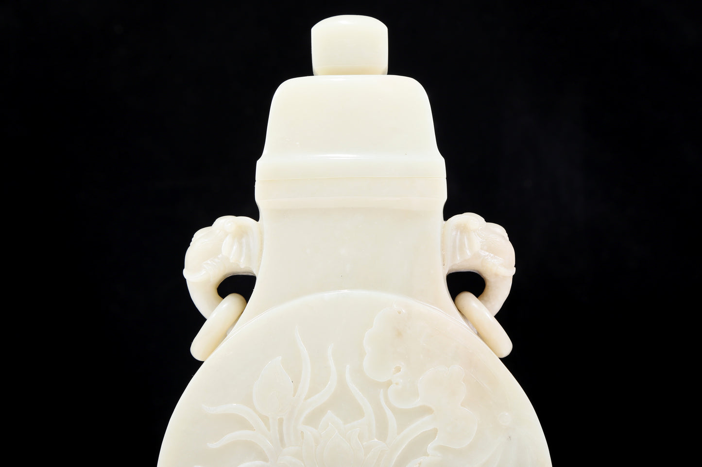 An exquisite white jade elephant ear vase with flower and bird patterns and lid